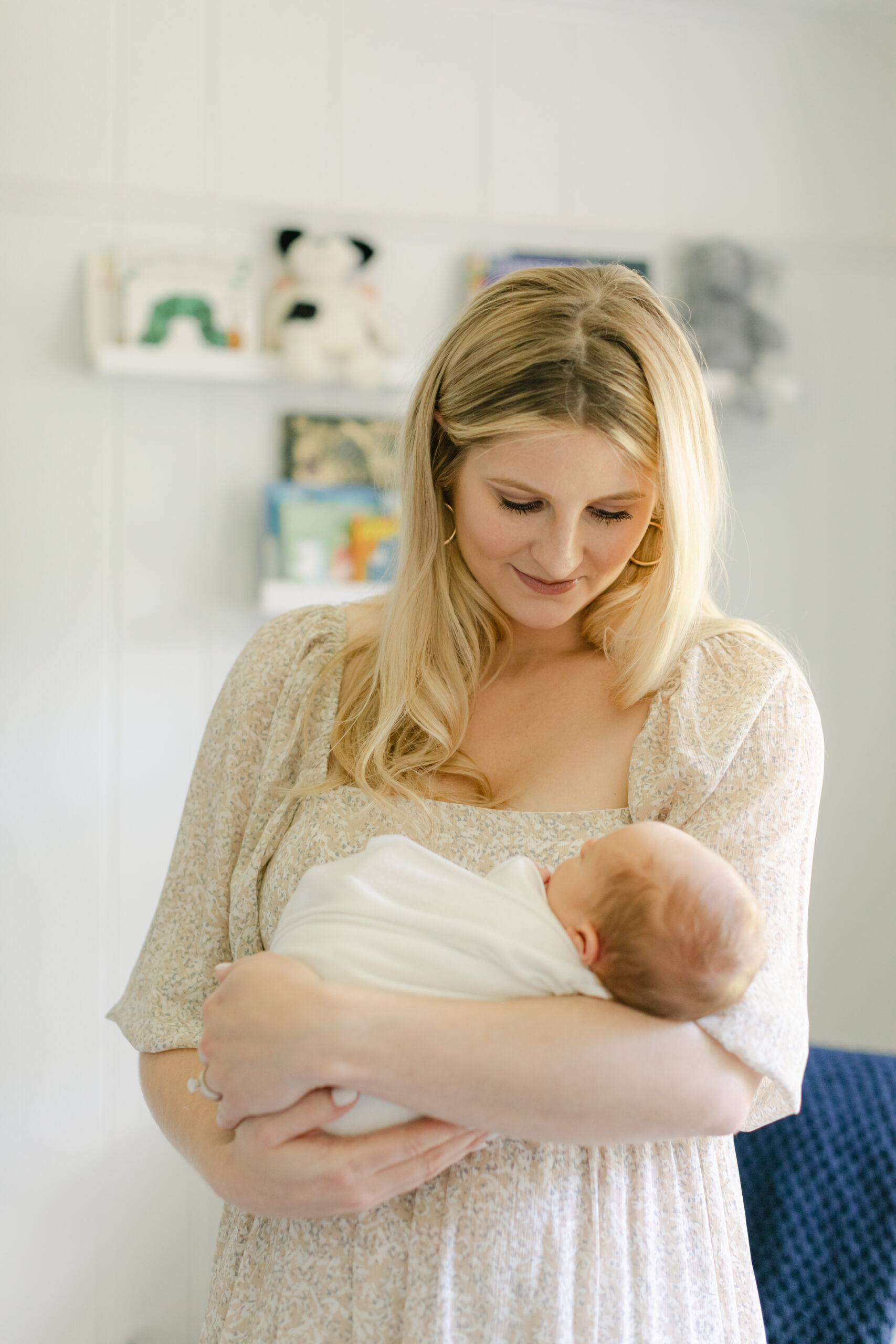 Mom with baby in nursery as an example of favorite gifts from baby braithwaite by atlanta newborn photographer