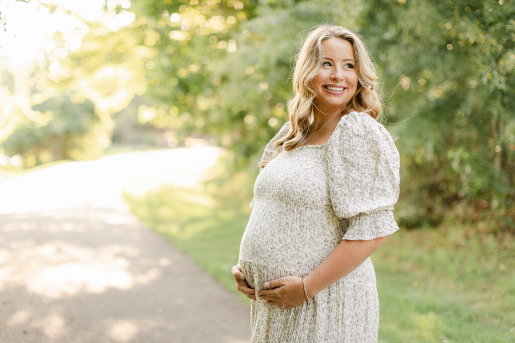 pregnant woman in park as an example of best spots for prenatal yoga in atlanta