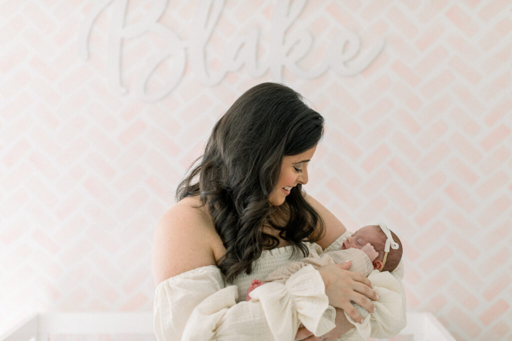 Woman with newborn baby as an example of newborn photos in Atlanta
