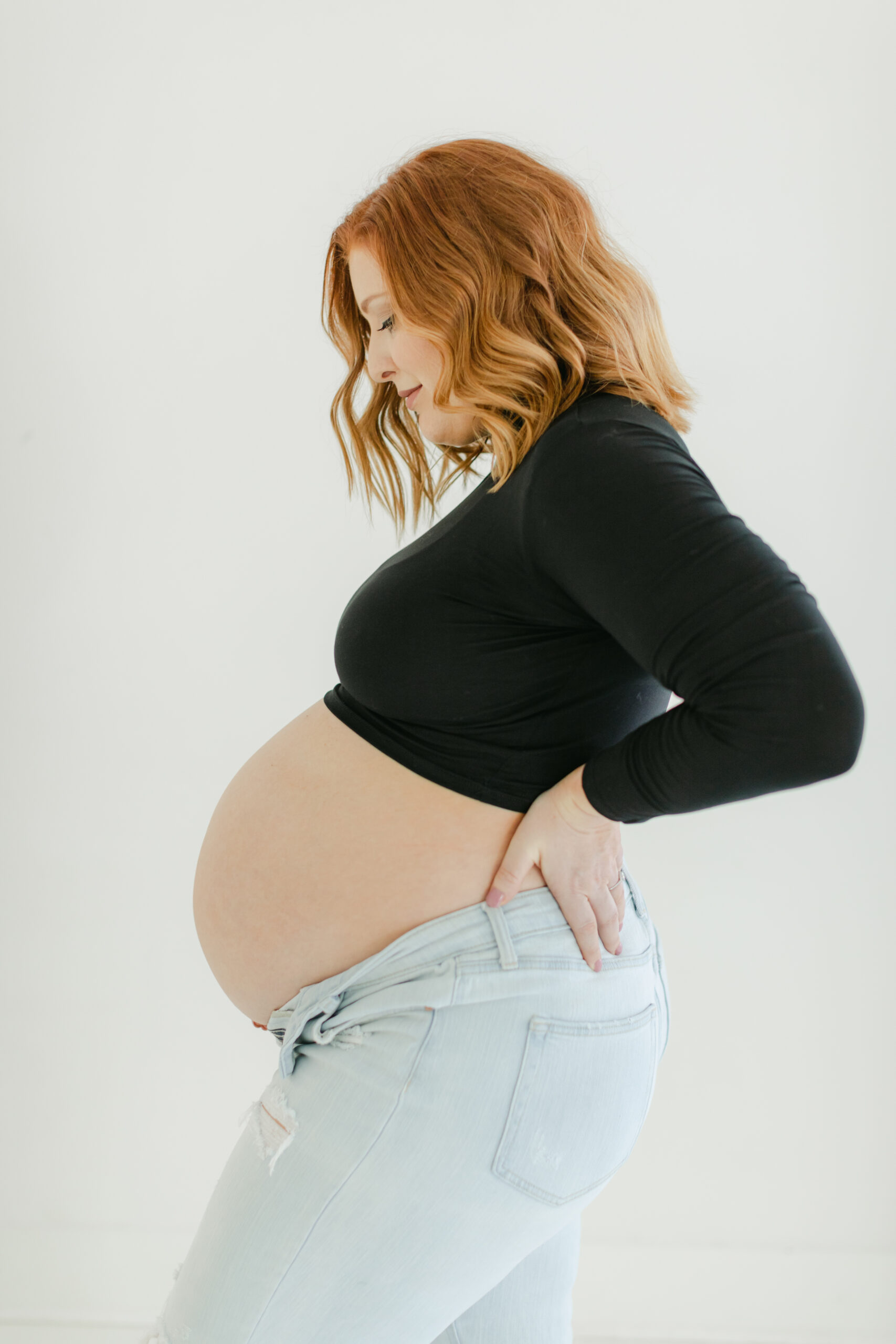 Photo of a pregnant woman as an example of maternity photography in Alpharetta GA by Atlanta maternity photographer Christy Strong Photography